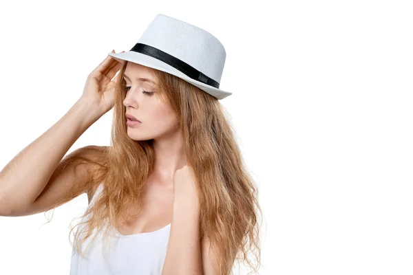 Beautiful slytish woman posing in fedora hat — Stock Photo, Image