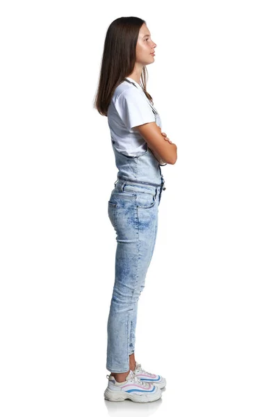 Full length profile portrait of a teen girl standing looking in front — Stock Photo, Image