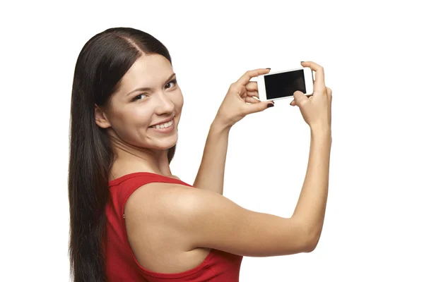 Mulher tirando fotos através do telefone celular — Fotografia de Stock