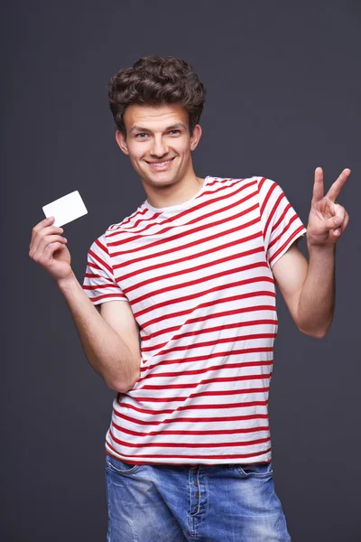 Mann zeigt leeres Papierkartenschild — Stockfoto