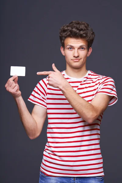 Man showing empty blank paper card sign Stock Picture