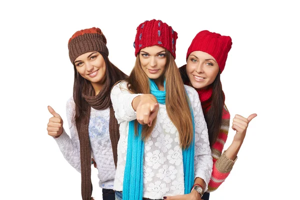 Three girls showing approving gestures pointing at camera — Stock Photo, Image