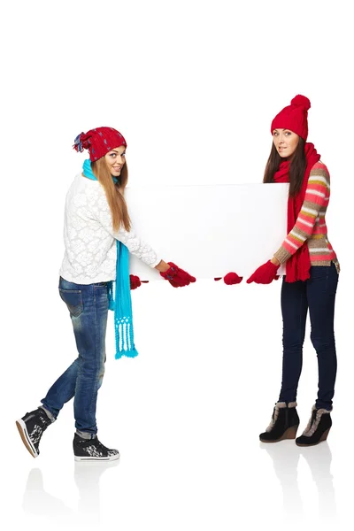 Two winter females with banner — Stock Photo, Image