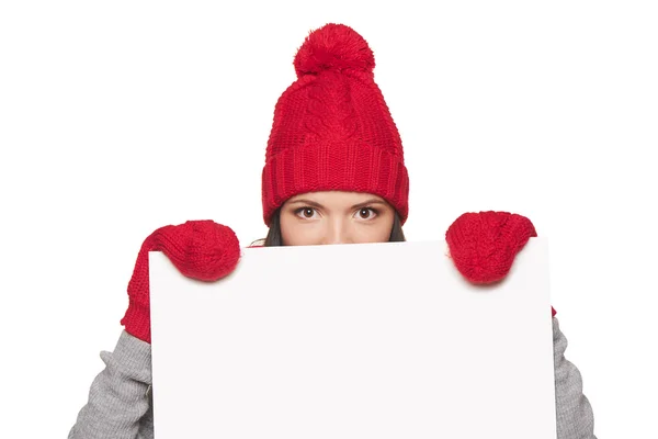 Mujer de invierno asomándose por la pizarra Imagen de stock