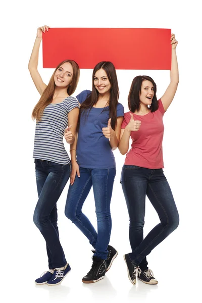 Three girl friends with red banner — Stock Photo, Image
