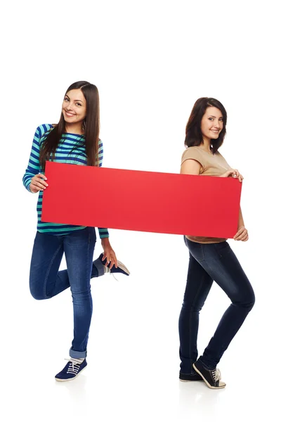 Two girl friends with red banner — Stock Photo, Image