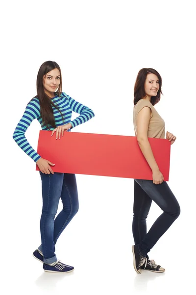 Two girl friends with red banner — Stock Photo, Image