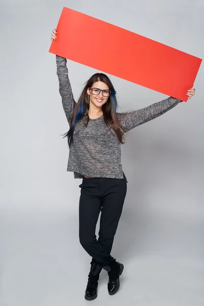 Woman holding red blank cardboard — Stock Photo, Image