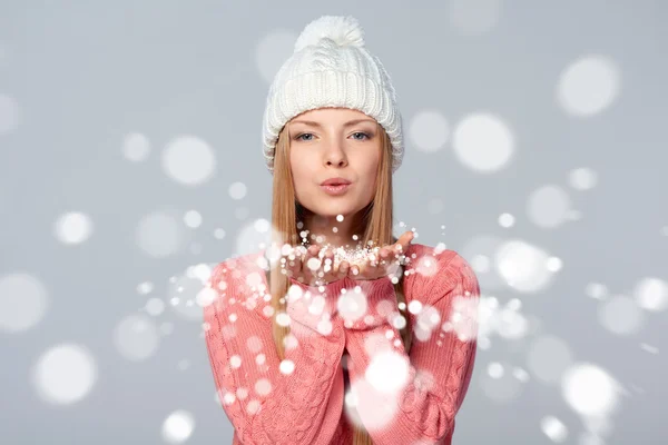Woman blowing snow at you — Stock Photo, Image