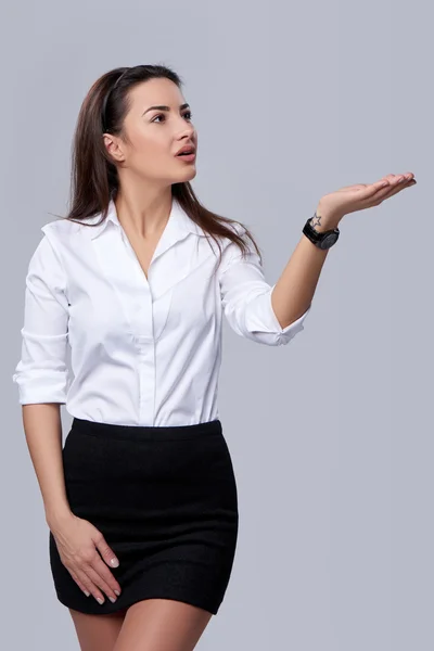 Business woman blowing on palm — Stock Photo, Image