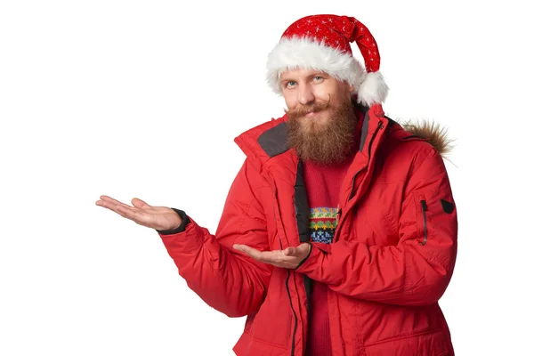 Helder beeld van knappe man in kerstmuts. — Stockfoto