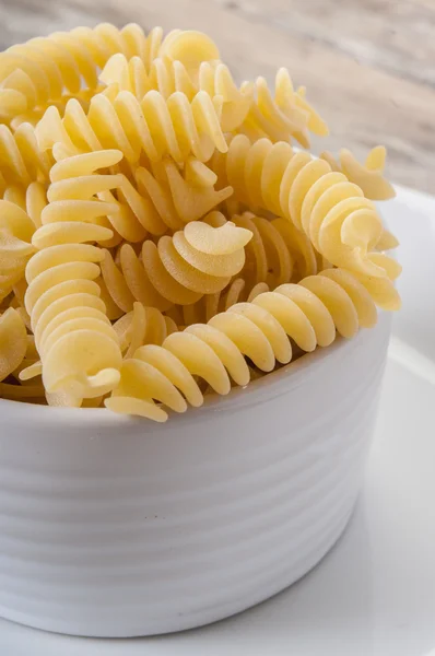 Pasta on wooden background — Stock Photo, Image