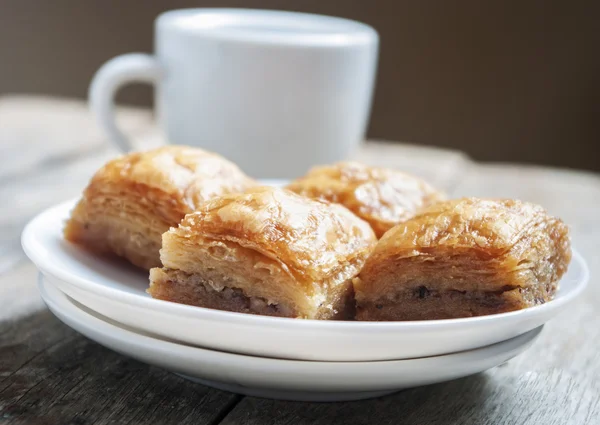 Baklava de cerca con taza de café —  Fotos de Stock