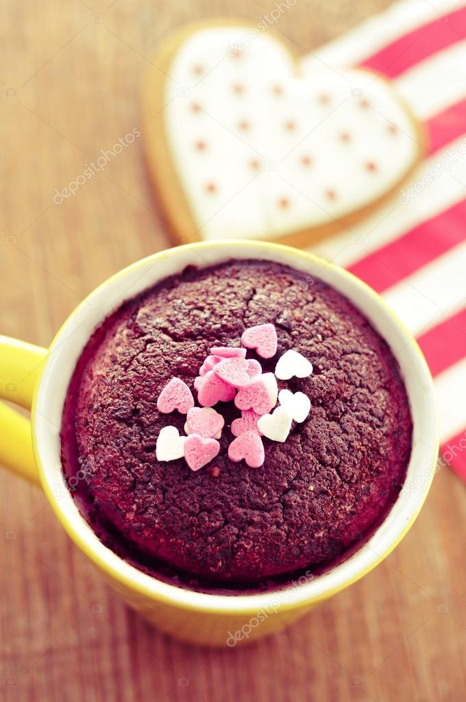 chocolate mug cake and heart-shaped cookie