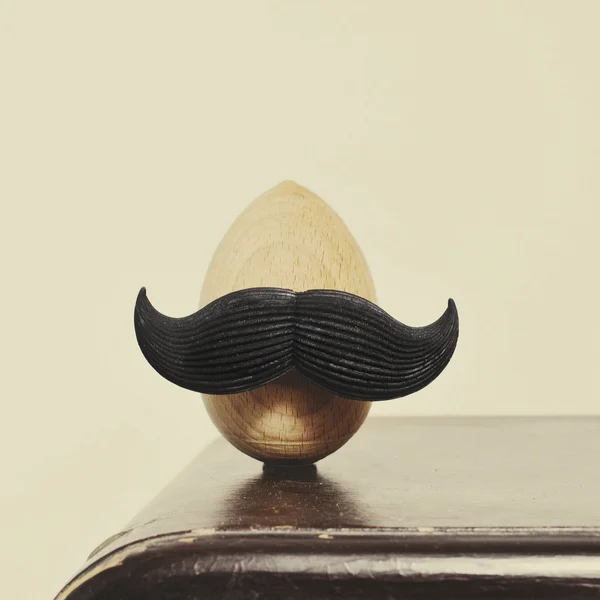 Mustached wooden egg — Stock Photo, Image