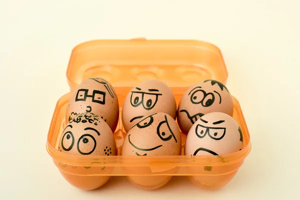 Brown eggs with funny faces — Stock Photo, Image