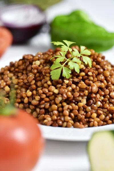 Plate with cooked lentils — Stock Photo, Image