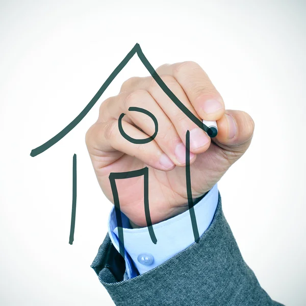 Businessman drawing a house — Stock Photo, Image