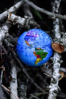 world globe in the forest clipart