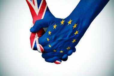 hands patterned with the British and the European flag clipart