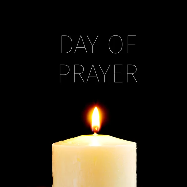 Lit candle and text day of prayer — Stock Photo, Image