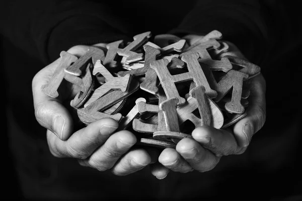 Man with wooden letters in his hands — Stock Photo, Image