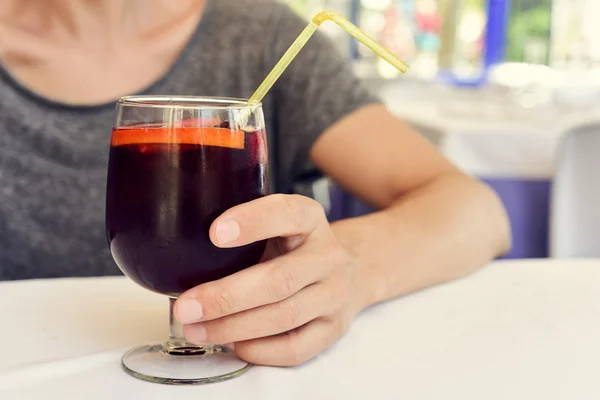 Young man with a glass of spanish sangria — Stock Photo, Image