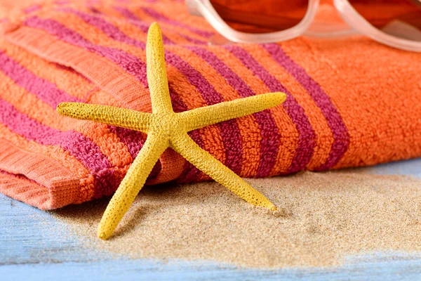 Starfish, sunglasses and beach towel — Stock Photo, Image