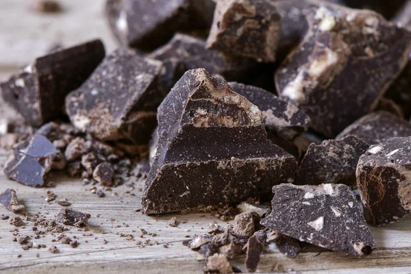 Chocolate on a rustic wooden surface — Stock Photo, Image