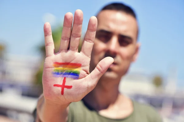 Pluszjel, transzneműek Hiv-pozitív emberek és a Szivárvány zászló — Stock Fotó