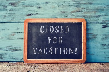 text closed for vacation in a chalkboard clipart