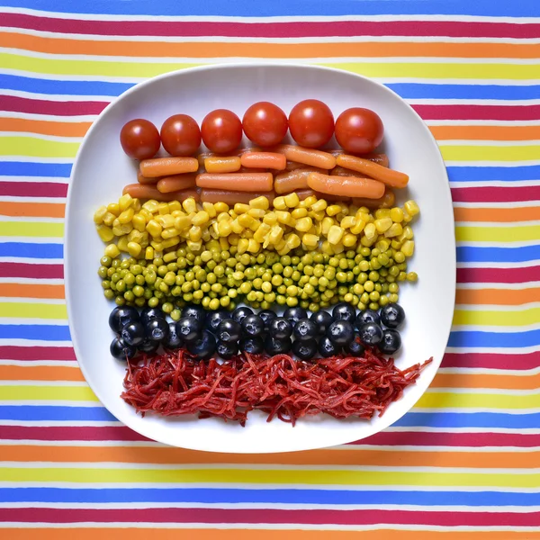 Verduras que forman la bandera del arco iris — Foto de Stock