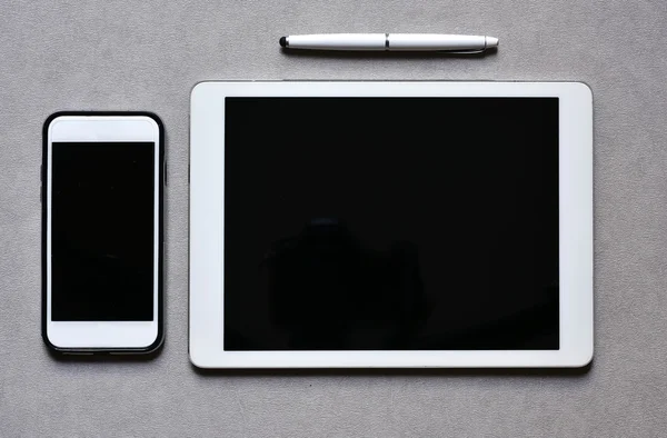 Smartphone and tablet with a black blank space — Stock Photo, Image