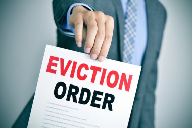 man in suit with an eviction order clipart