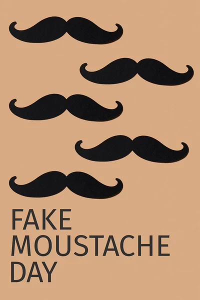 Some Moustaches Made Cutouts Black Cardboard Text Fake Moustache Day — Stock Photo, Image