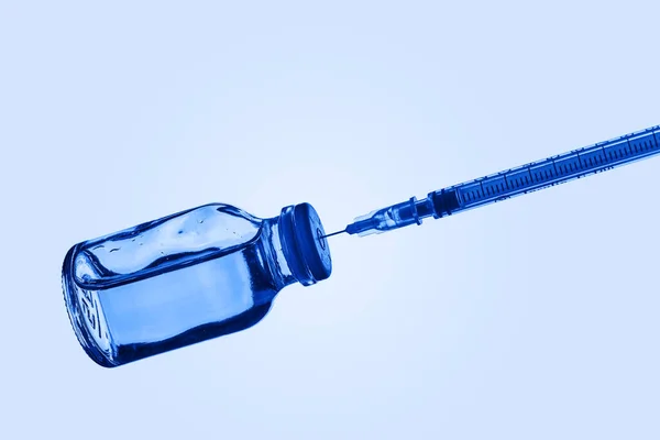 Closeup Syringe Vaccine Vial Blue Liquid Pale Blue Background Some — Stock Photo, Image