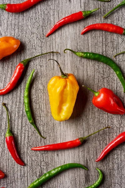 High Angle View Different Chili Peppers Gray Rustic Wooden Table — Stock Photo, Image