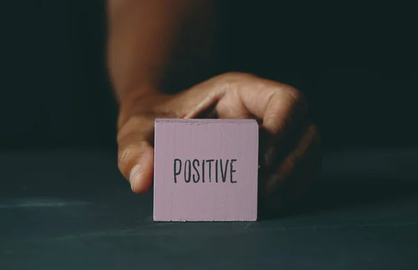 Young Caucasian Man Shows Pink Building Block Text Positive Written — Stock Photo, Image