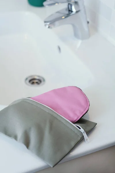 Closeup Pink Cloth Menstrual Pad Peeking Out Gray Toilet Bag — Stock Photo, Image