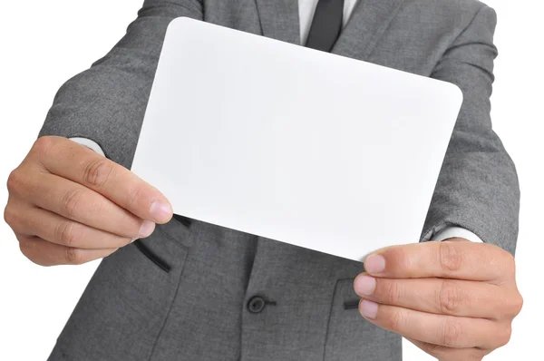 Man in suit holding a blank signboard — Stock Photo, Image