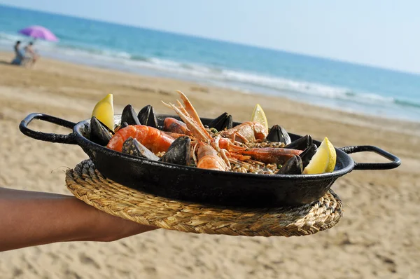 Spanish paella on the beach — Stock Photo, Image