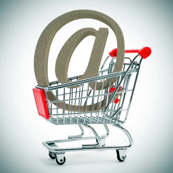 At sign in a shopping cart — Stock Photo, Image