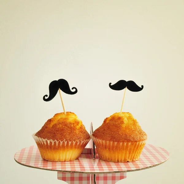 Moustaches in cupcakes, with a retro effect — Stock Photo, Image