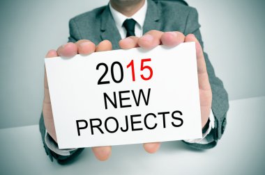 metin 2015 yeni projelerle bir tabela ile takım elbiseli adam