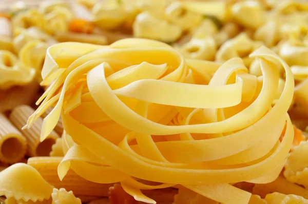 Different types of uncooked pasta — Stock Photo, Image