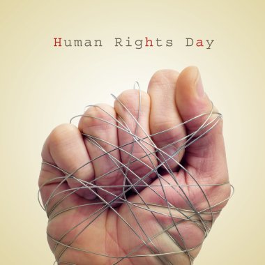 man hand tied with wire and the text human rights day clipart
