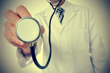 doctor using a stethoscope, with a retro effect clipart