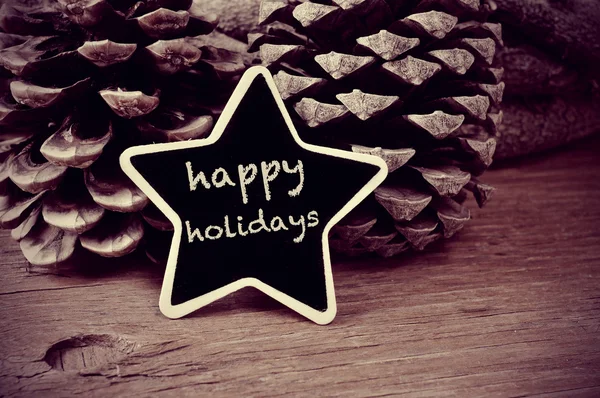 Text happy holidays in a star-shaped blackboard, in black and wh — Stock Photo, Image