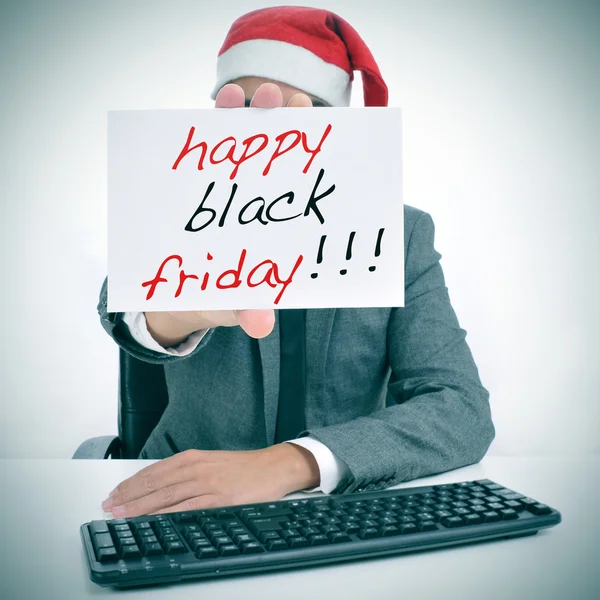 Man with a signboard with the text happy black friday — Stock Photo, Image