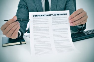 young man showing a confidentiality agreement document clipart